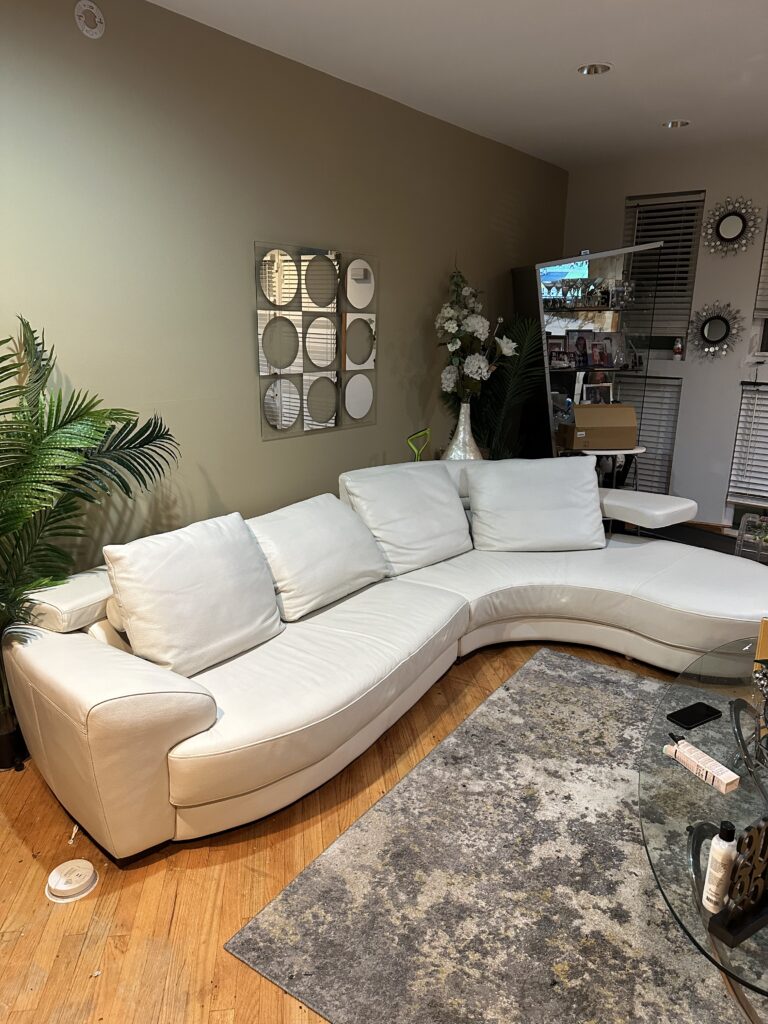 Restored white leather sofa after repair