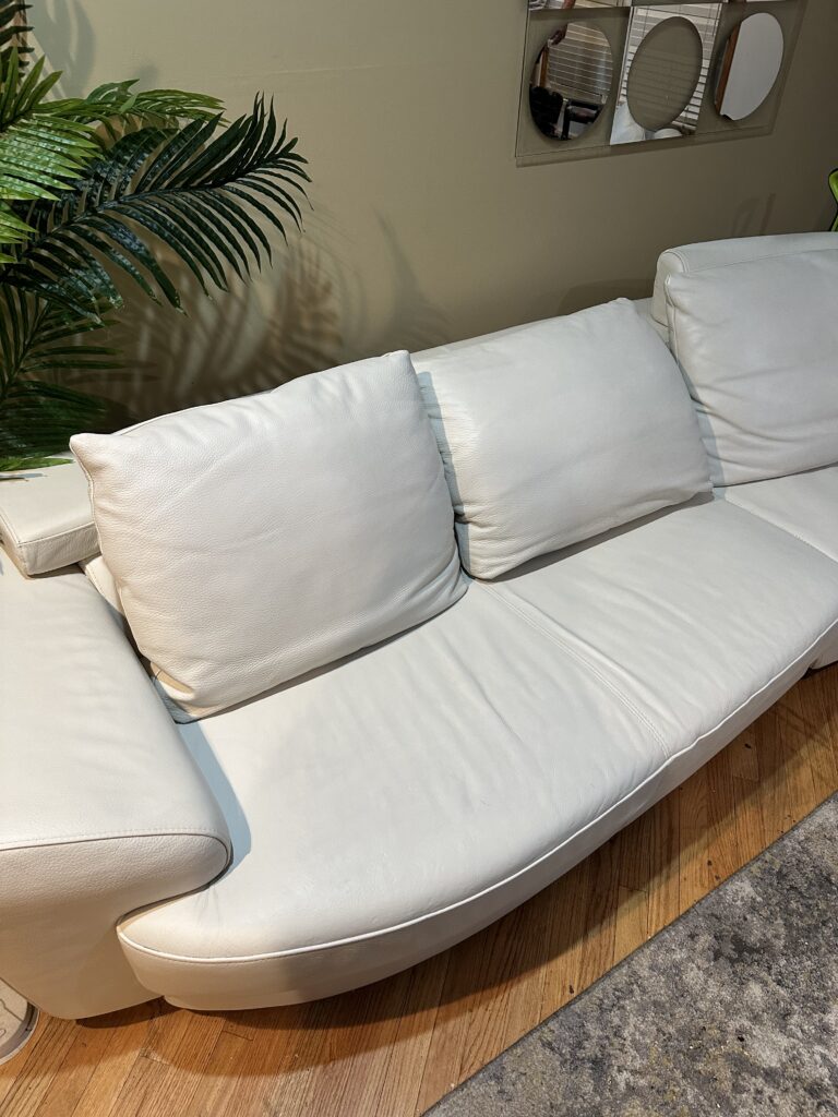 White leather sofa cleaning and repair in progress