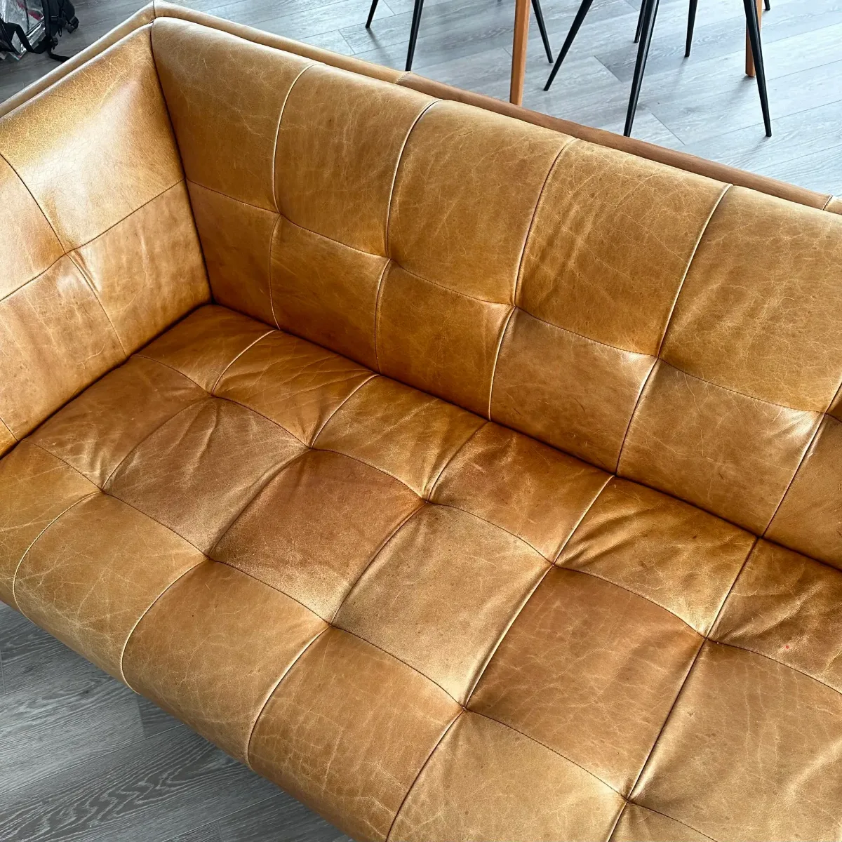 Full sofa recoloring in a bold solid orange (before)