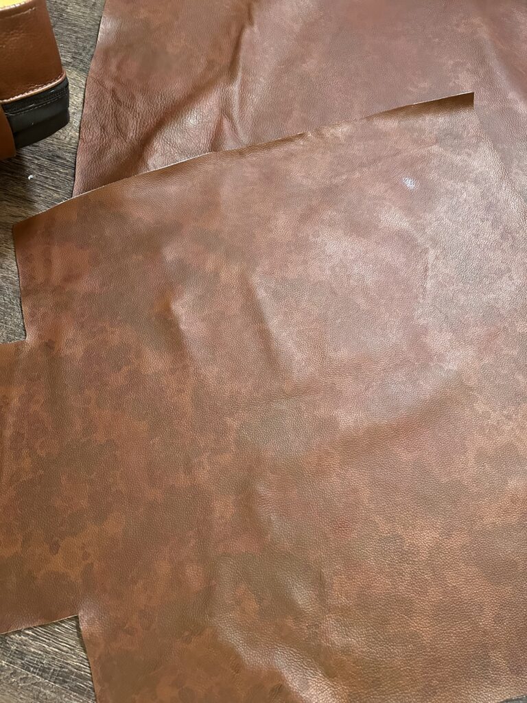 Leather colored by hand to match the sofa, then sewn into a new seat cushion cover (before)