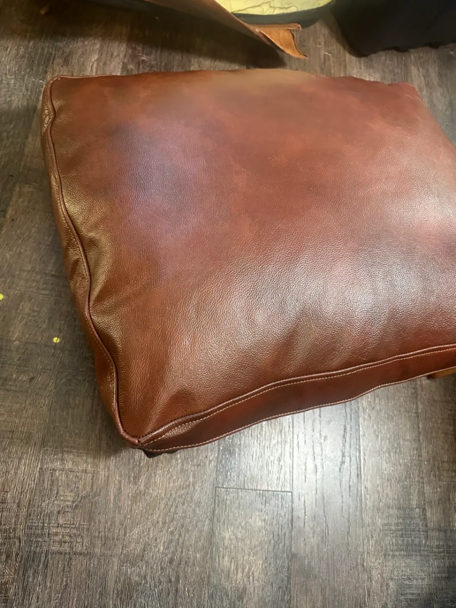 Cushion torn by a dog: new leather sewn, color matched (after)