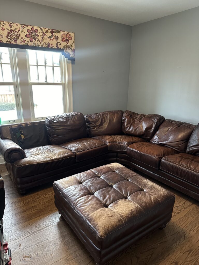 Worn leather furniture set before restoration