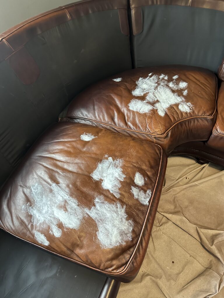 Cushion rebuild and leather repair in progress