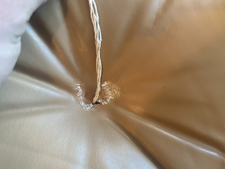 Process — stitching and reinforcing the tear