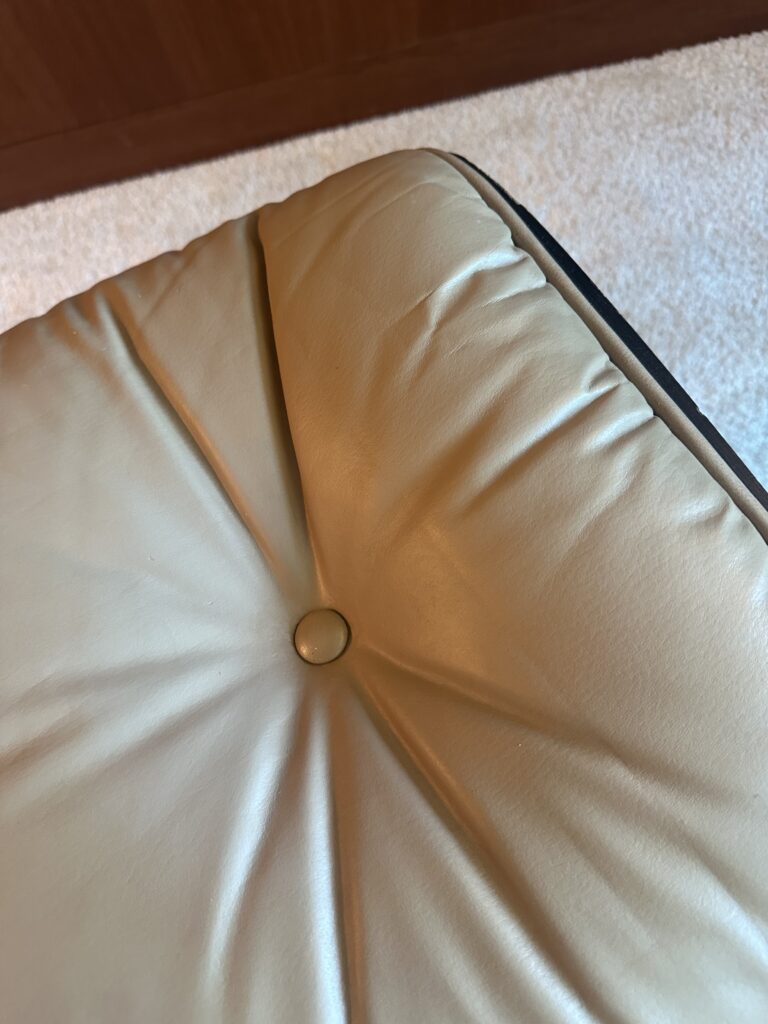 Leather cushion after repair — restored surface and smooth shape