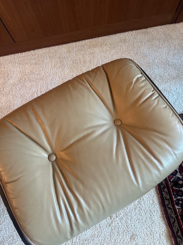Leather cushion after repair — restored surface and smooth shape
