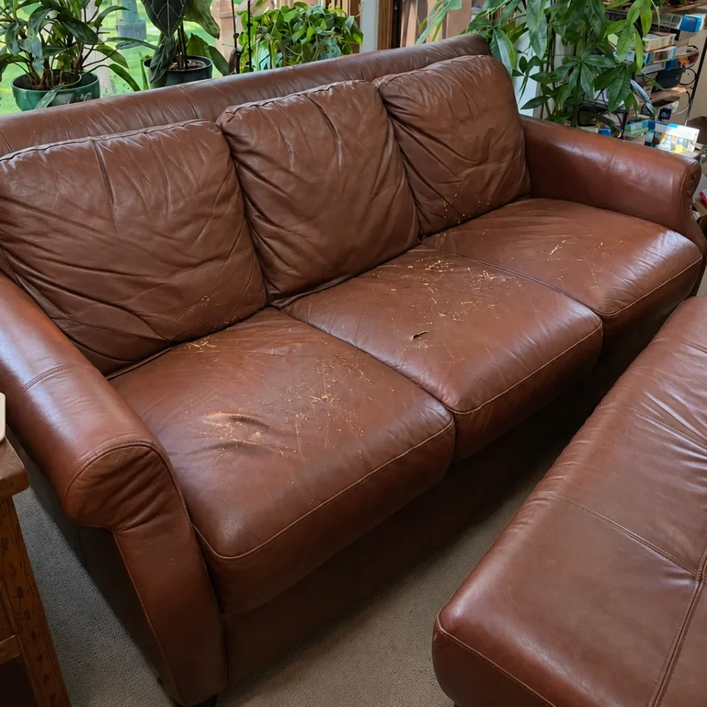 Leather sofa seat tops reupholstered — before