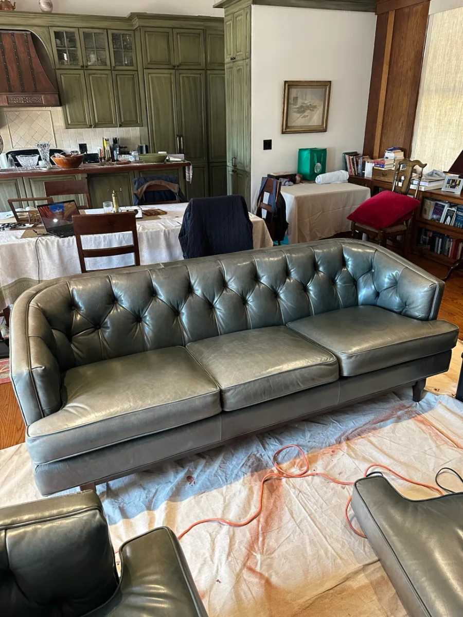 Faded tufted sofa recolored to match the kitchen (before)