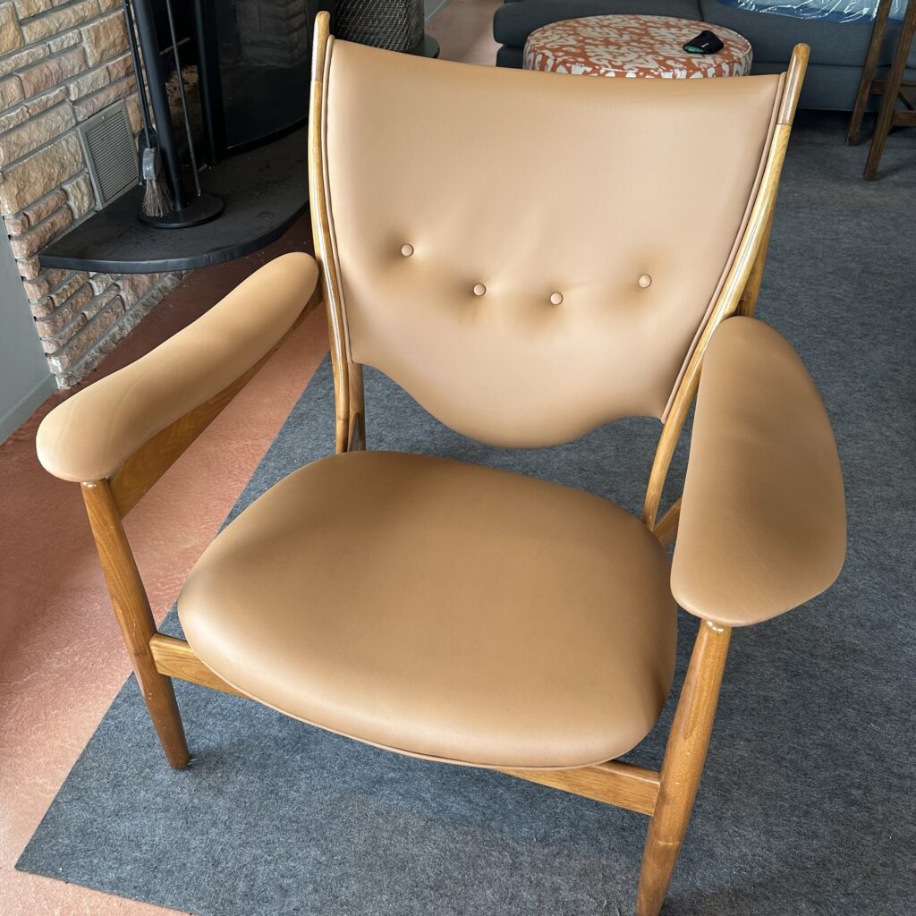 Leather armchair with buttons — after
