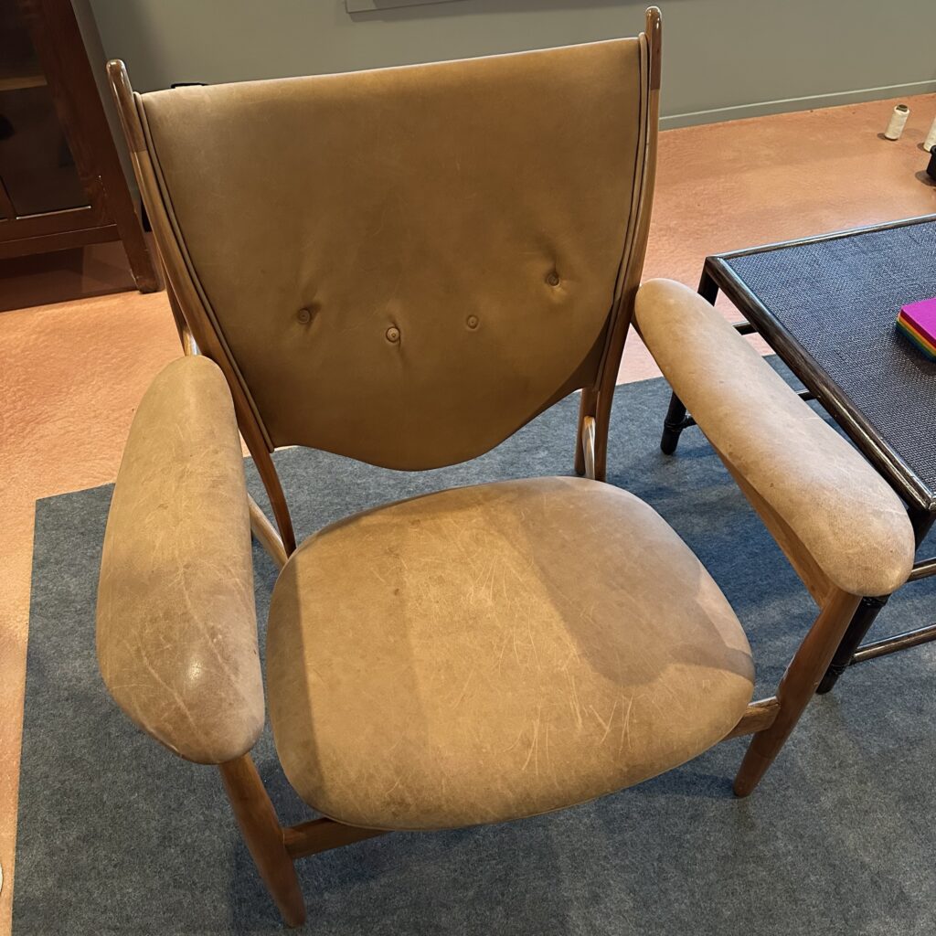 Leather armchair with buttons — before