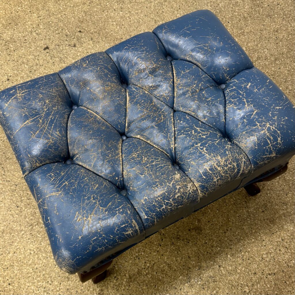 Antique tufted leather armchair and ottoman set: cracked leather restored (before)