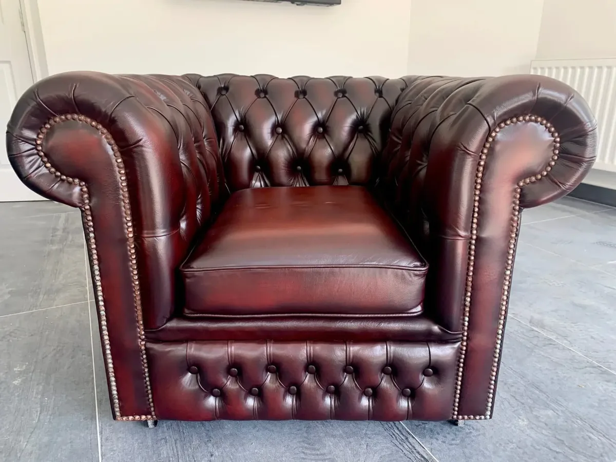Chesterfield chair restoration with a patina-style finish (after)
