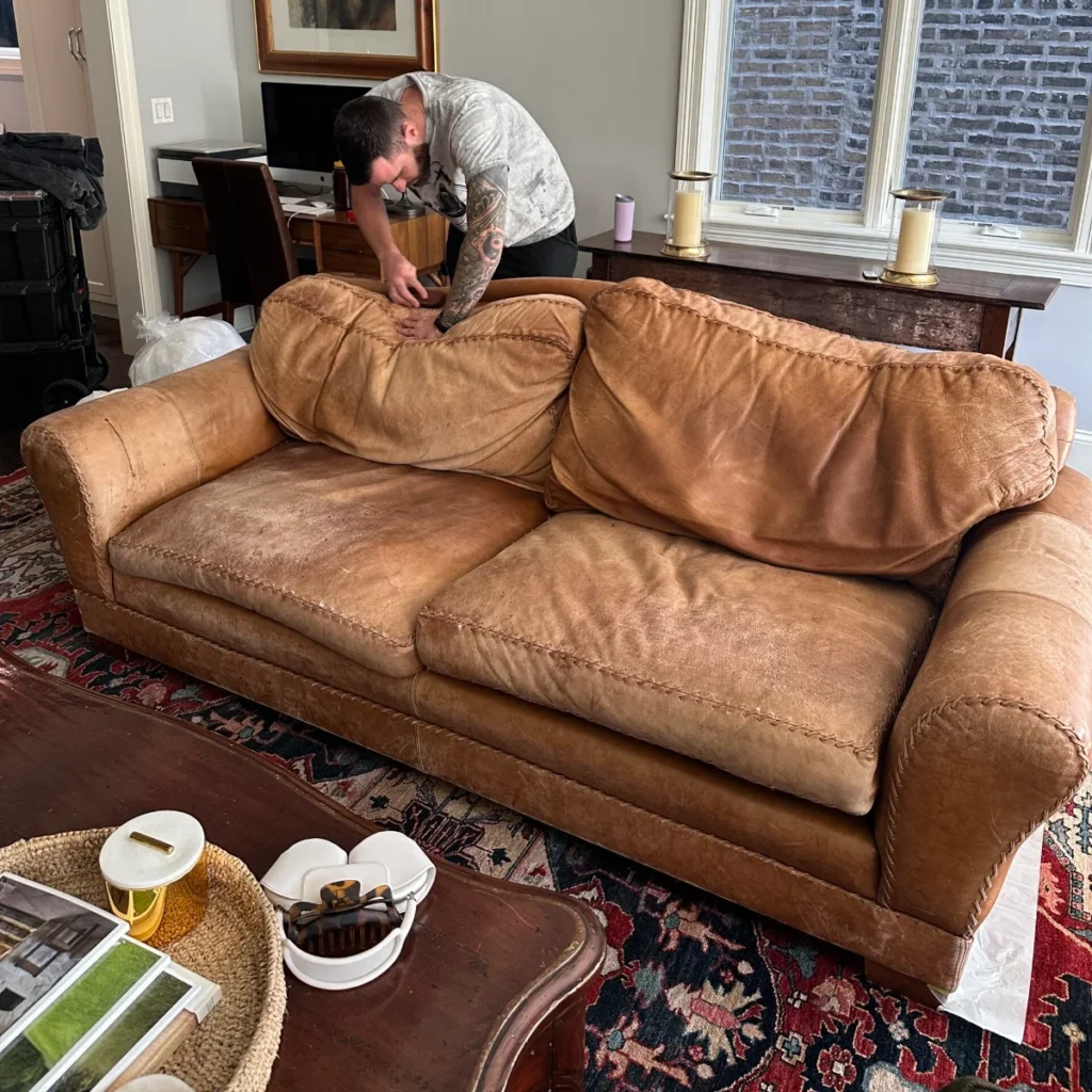 Tan leather sofa: sagging, worn cushions refilled and restored (before)