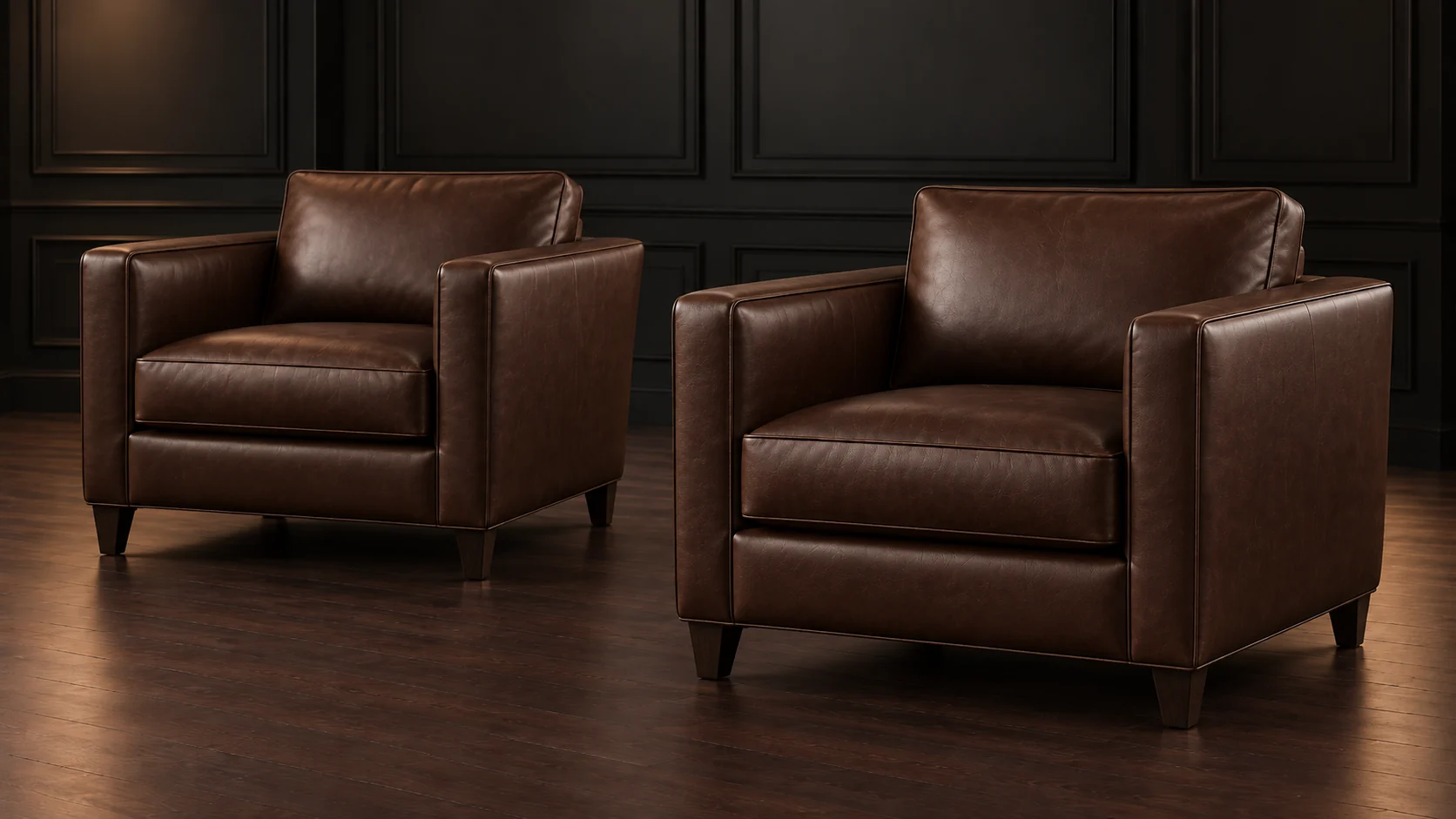 Two brown leather armchairs